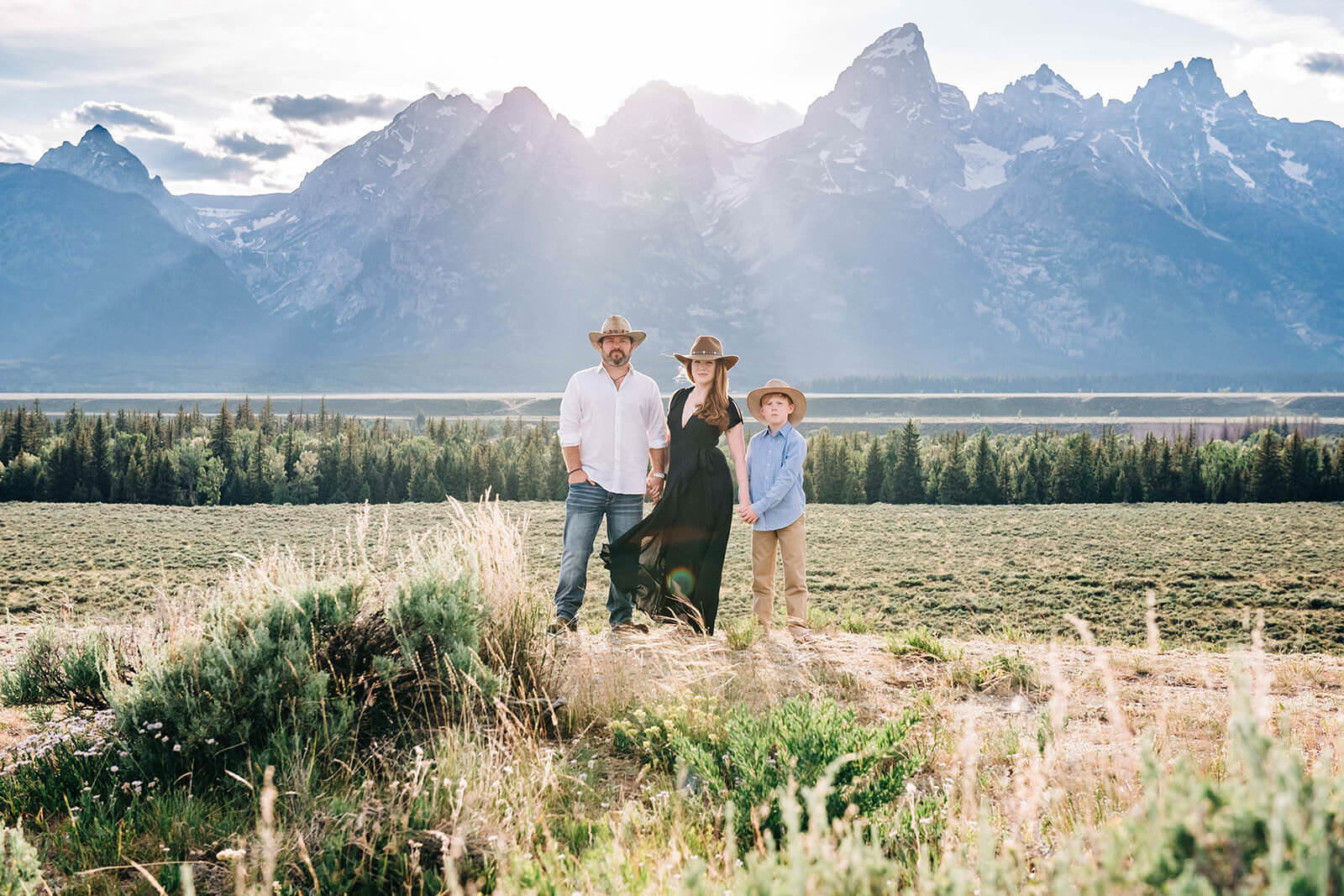 amily portrait by mountains Grand Tetons