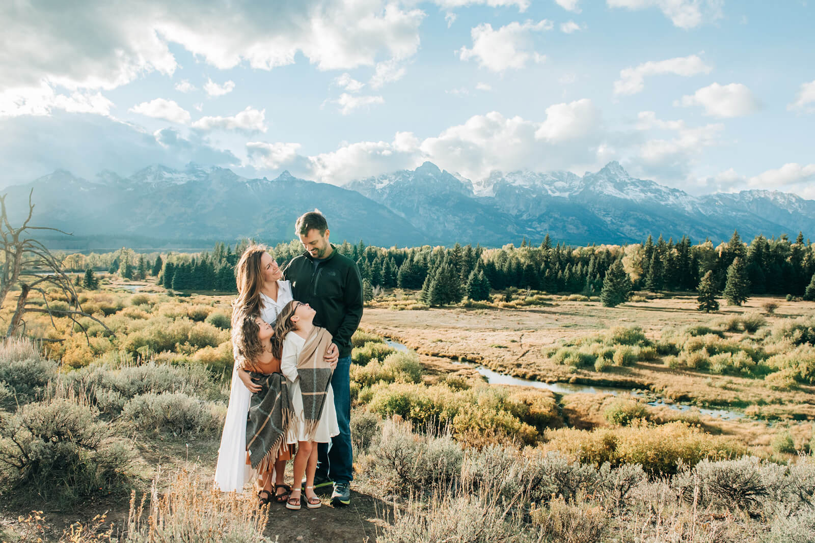 Family Portrait in Meadow with Mountains