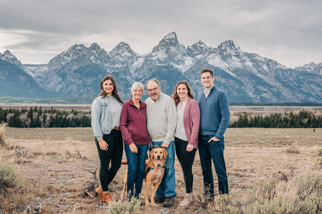 Family Portrait by Mountains with Dog